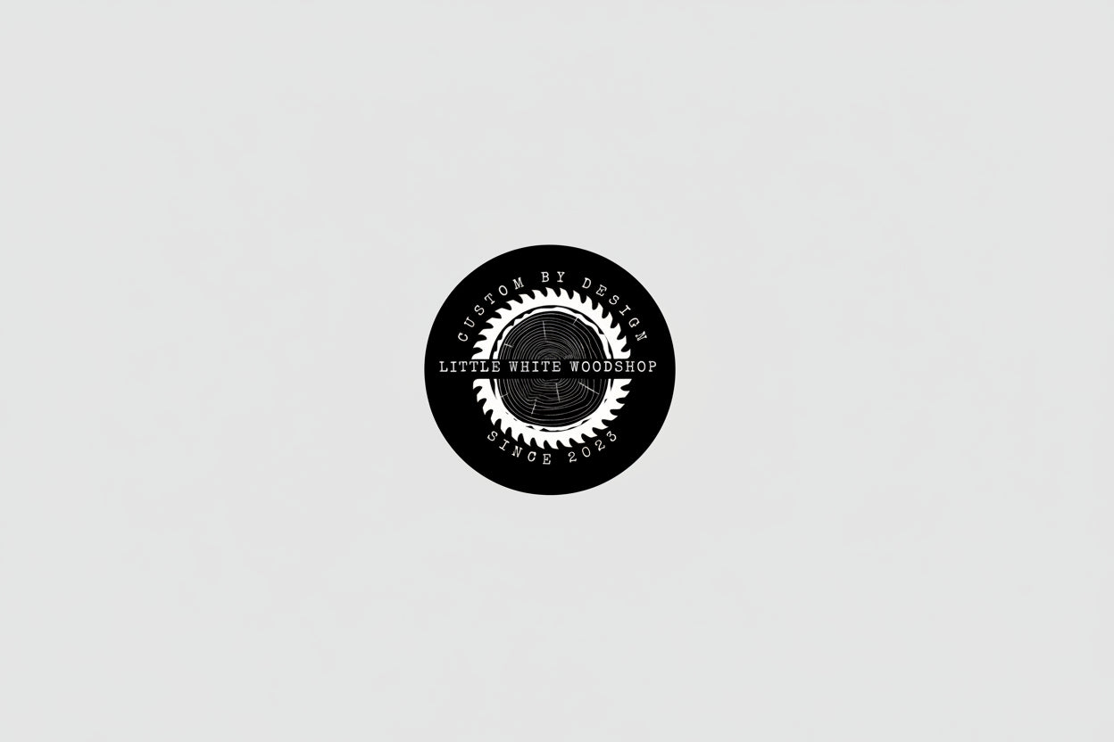 Circular logo for Little White Woodshop with a saw blade design on a black background.